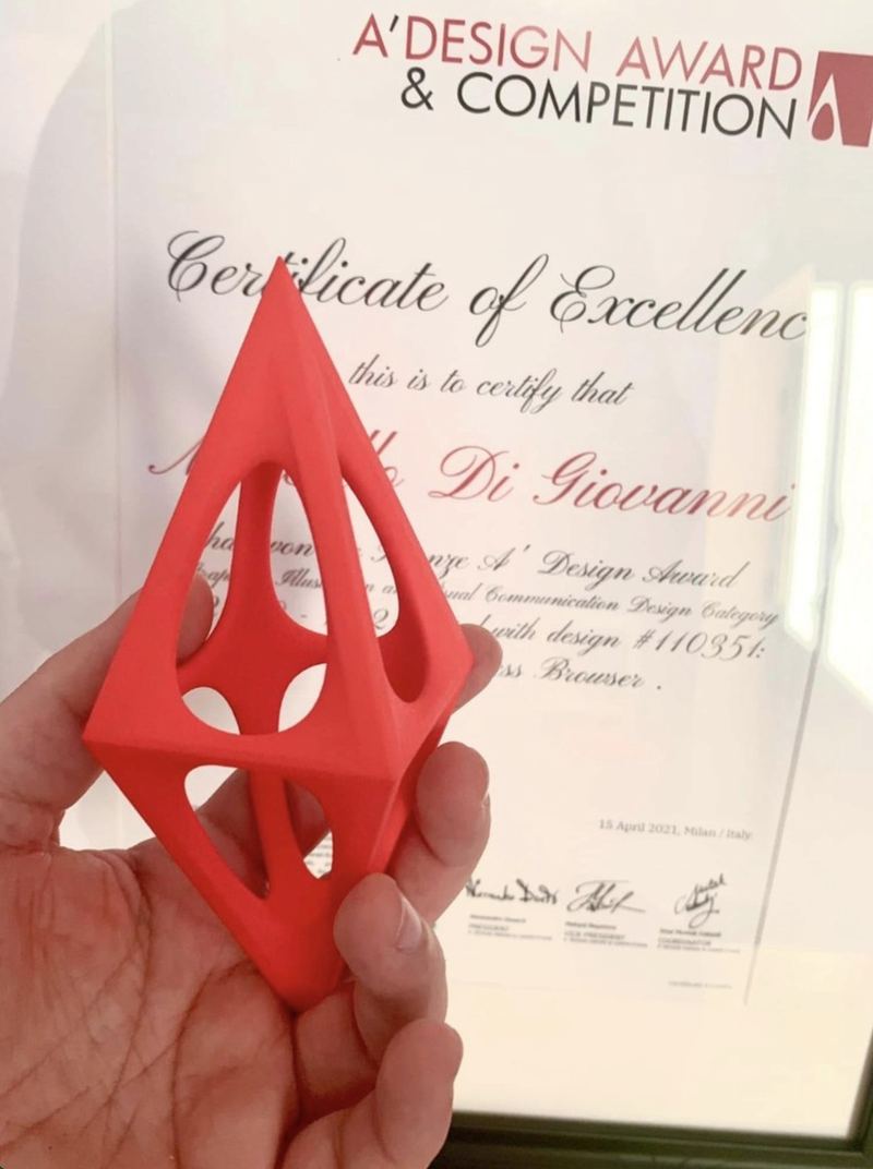 Holding the A' Design Award trophy in front of the certificate
